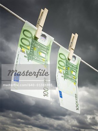 Low angle view of two one hundred Euro banknotes pegged on a clothesline