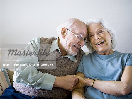 Close-up of a senior couple holding hands