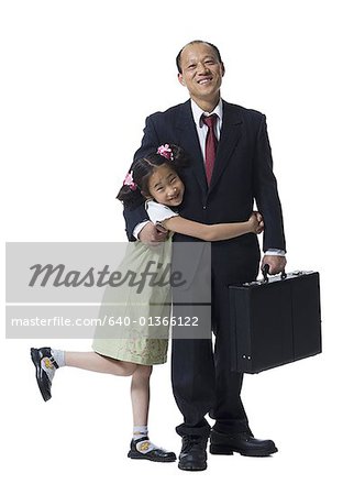 Portrait of a girl hugging her father