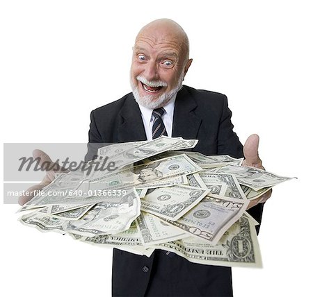 Close-up of a businessman holding American dollar bills in a tray