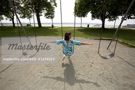 Woman Sitting on Swing