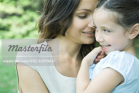 Girl and mother, smiling, portrait
