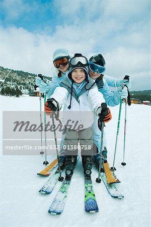 Young skiers, full length portrait