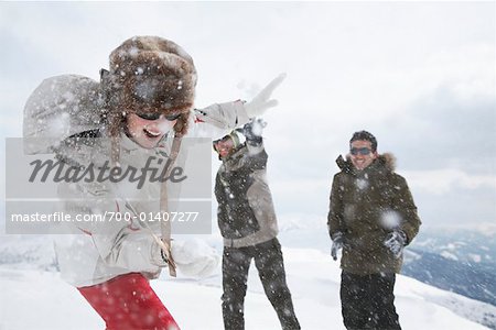 Friends Having Snowball Fight