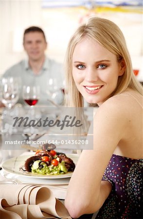 Young woman dining in a restaurant