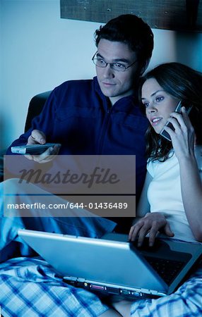 Young couple watching television