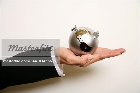 A woman holding a globe