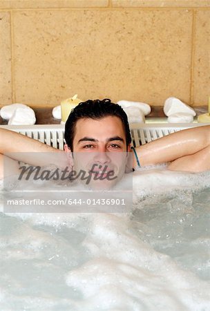One man in jacuzzi at a spa
