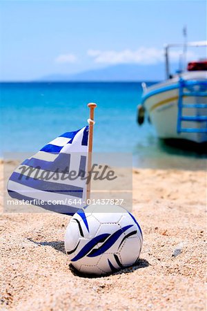 Ball and Greek flag on beach