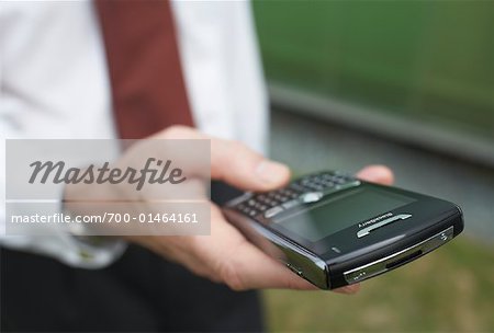 Businessman Holding Electronic Organizer