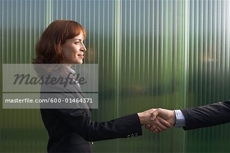 Businesswoman and Businessman Greeting