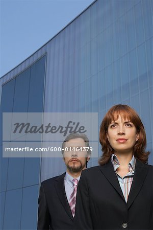 Woman and Man in Front of Building