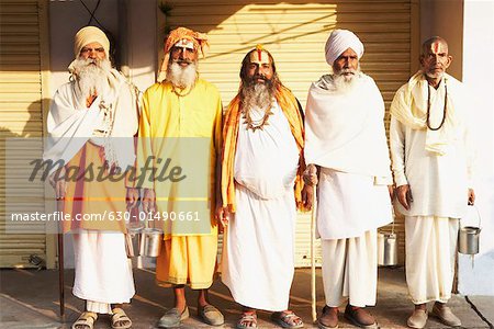 Five sadhus standing side by side