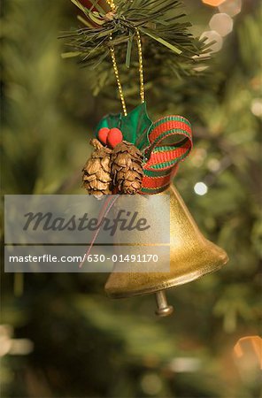 Close-up of a Christmas bell hanging on a Christmas tree