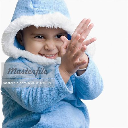 Close-up of a boy clapping