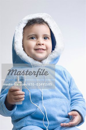 Close-up of a boy listening to an MP3 player
