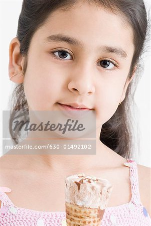 Portrait of a girl holding an ice cream cone