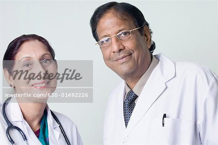 Portrait of a male doctor smiling with a female doctor