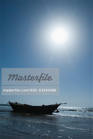 Fishing boat on the beach, Morjim Beach, Goa, India