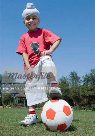 Portrait of a boy playing with a soccer ball
