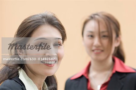 Portrait of two businesswomen smiling