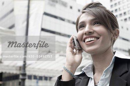 Close-up of a businesswoman talking on a mobile phone