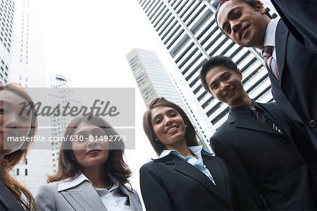 Low angle view of five business executives standing together