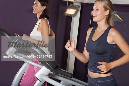 Women Working Out on Treadmills
