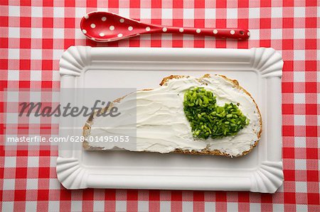 Bread with cream cheese and heart shaped chives