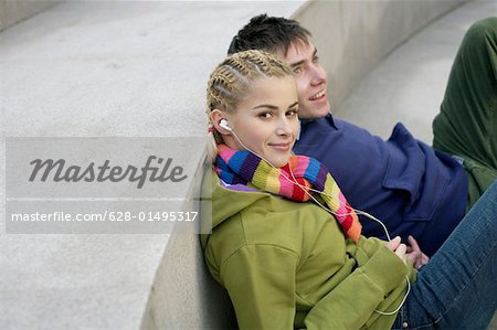 Young couple sitting on staircase