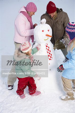 Family making a snowman
