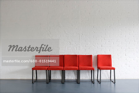 Red Chairs against Wall