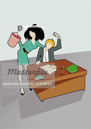 Man at desk playing ball with a piece of crumbled paper with his secretary