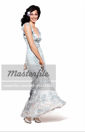Woman twirling her long silvery gown