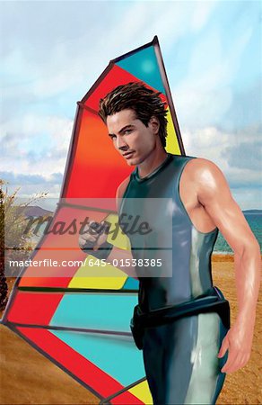 Young man posing on the beach with his windsurf sail