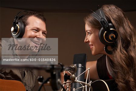 People Singing in Recording Studio