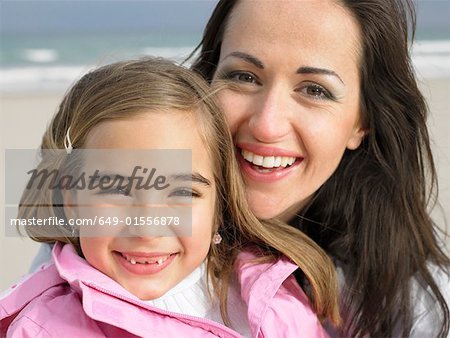 Young girl (6-8) and mother, close-up, portrait. Alicante, Spain.