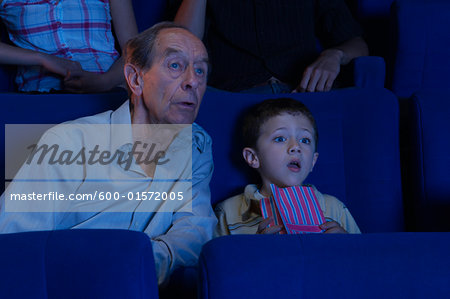 Grandfather and Grandson at Movie Theatre