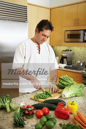 Man in Kitchen Preparing Dinner