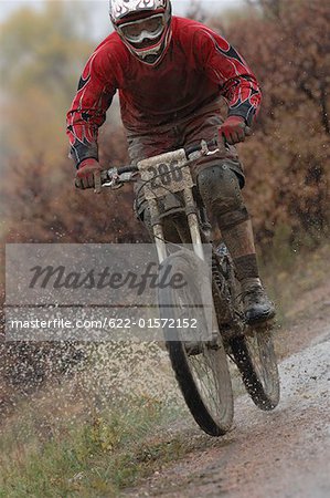 Mountain Biker Going through Water