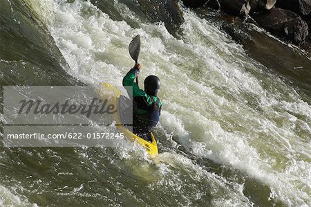 Kayaker Negotiating the River