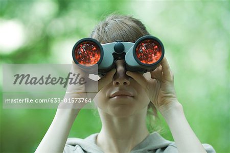 Woman looking through binoculars