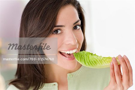 Woman Eating Lettuce