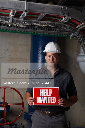 Portrait of Worker Holding Sign