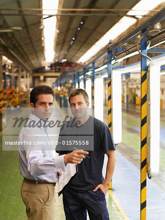 Men Talking in Automotive Plant