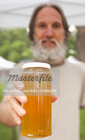 Man Holding Jar