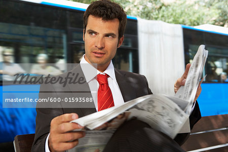 Businessman Holding Newspaper