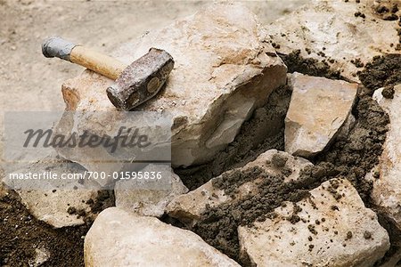 Stonemason Hammer and Stone Wall