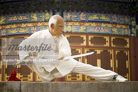 Man with sword doing Kung Fu