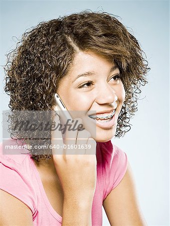 Girl with braces talking on cell phone smiling